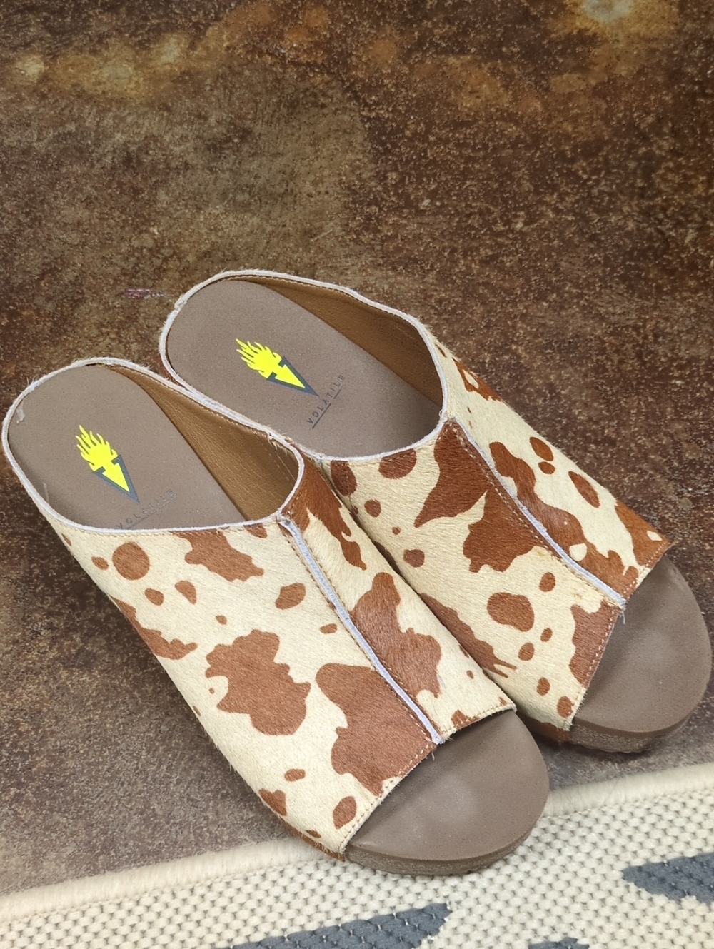 Open-Toe Slide Mules in Brown Cowhide Print